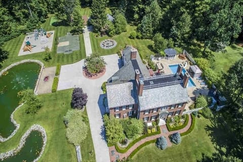Gorgeous home on 9 acres w/pool, hot tub, fire pit, playground, koi pond, & more
