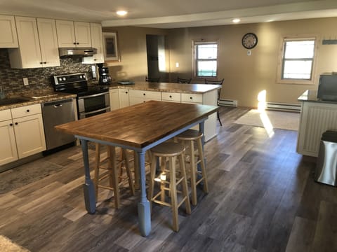 The table sits 6 and the counter sits 3. We have 7 total stools.