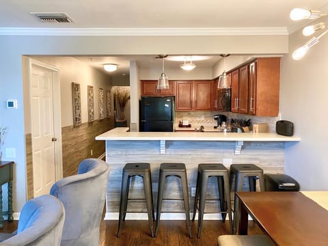 Open kitchen with bar seating