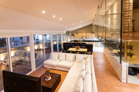 Penthouse | Living area | 50-inch Smart TV with satellite channels, TV
