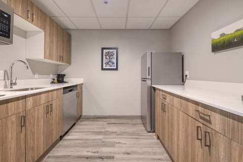 Suite, 1 King Bed, Kitchen, Corner | Private kitchen | Dishwasher, coffee/tea maker, cookware/dishes/utensils