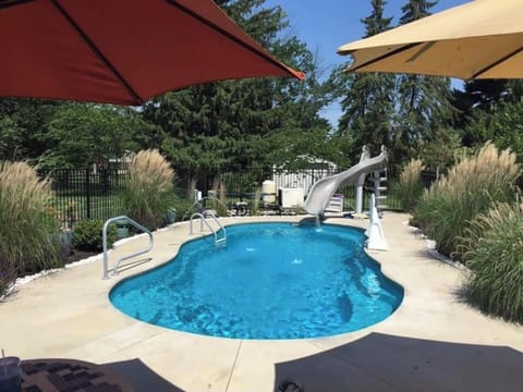 Private heated salt water pool with water slide. Open late April to late October