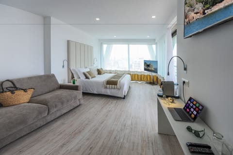 Deluxe Suite, Terrace, Partial Sea View | Minibar, in-room safe, desk, soundproofing