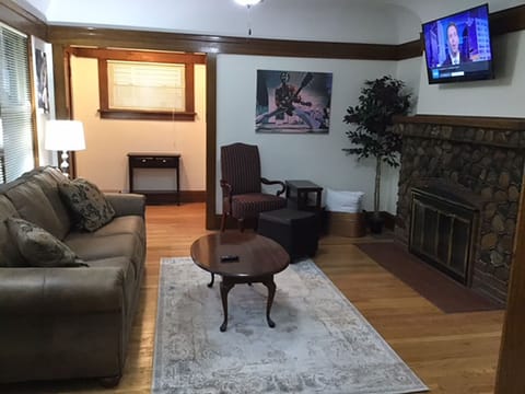 Cozy up to the fireplace as you enjoy the Spacious living room with 55" Smart TV