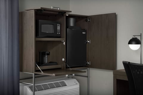 Desk, laptop workspace, blackout drapes, iron/ironing board