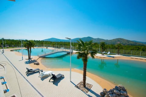 Seasonal outdoor pool, pool umbrellas, sun loungers