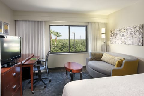 Desk, laptop workspace, blackout drapes, iron/ironing board