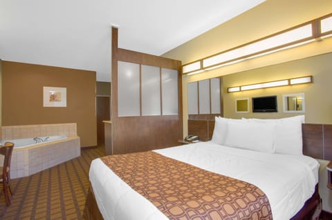 Studio Suite, 1 Queen Bed, Non Smoking, Jetted Tub | Hypo-allergenic bedding, desk, iron/ironing board