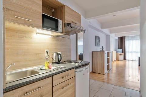 Apartment, 2 Bedrooms | Private kitchen | Fridge, microwave, stovetop, coffee/tea maker