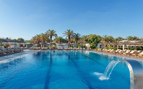 Seasonal outdoor pool, open 8:00 AM to 7:00 PM, pool umbrellas