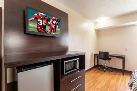 Desk, laptop workspace, iron/ironing board, free cribs/infant beds