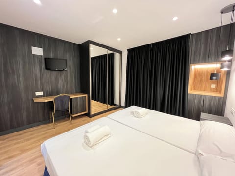 Standard Double or Twin Room | In-room safe, desk, blackout drapes, iron/ironing board