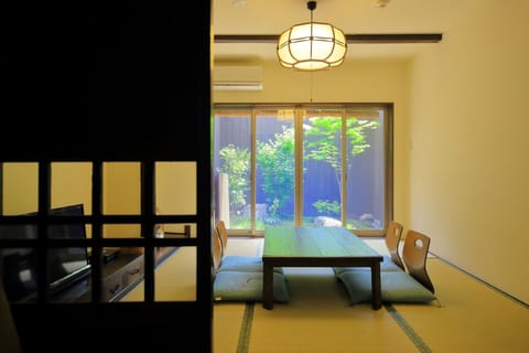 A living room with a view of the garden that colors every season