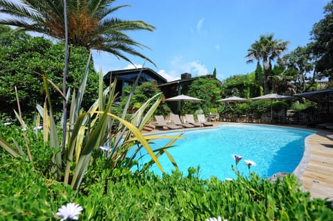 Seasonal outdoor pool, open 7:30 AM to 7:00 PM, pool umbrellas