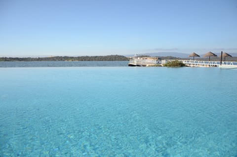 Indoor pool, outdoor pool, open 10:00 AM to 7:00 PM, pool umbrellas