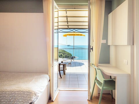 Panoramic Triple Room, Sea View | Minibar, in-room safe, desk, free WiFi