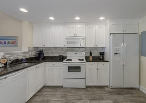 Kitchen comes with fridge (updated to stainless steel), range, microwave, dishwasher and Mr Coffee/Keurig