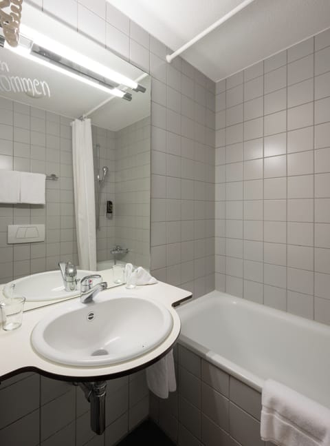 Combined shower/tub, hair dryer, towels, soap