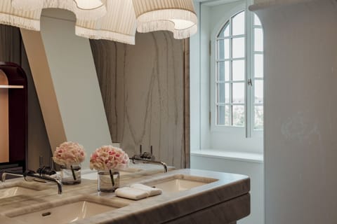 Designer toiletries, hair dryer, bathrobes, slippers