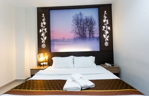 Deluxe Room | Premium bedding, desk, blackout drapes, iron/ironing board (on request)