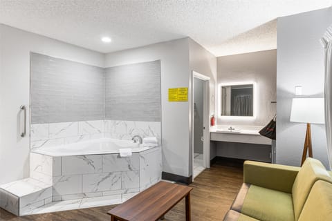 Suite, 1 King Bed, Non Smoking, Jetted Tub | Desk, laptop workspace, iron/ironing board, free WiFi