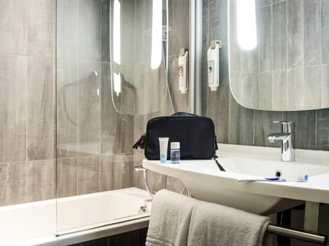 Premium bedding, desk, laptop workspace, blackout drapes