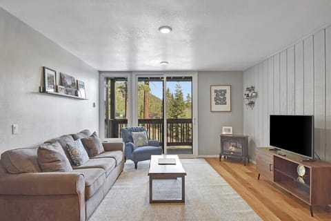 Comfortable Living Room with a Flat Screen TV and Electric Fireplace