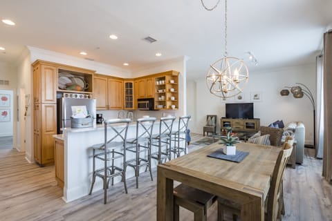 Kitchen and dining room. Dining room table seats 6 + 4 stools at counter.