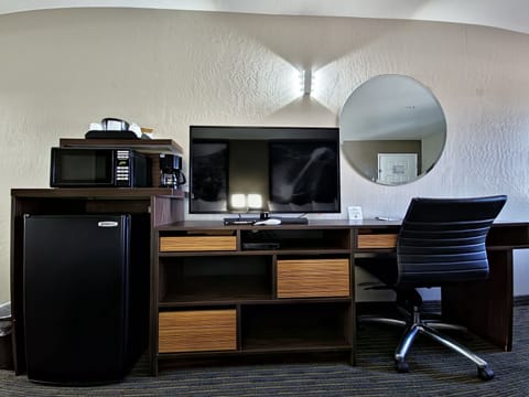 Desk, laptop workspace, blackout drapes, iron/ironing board