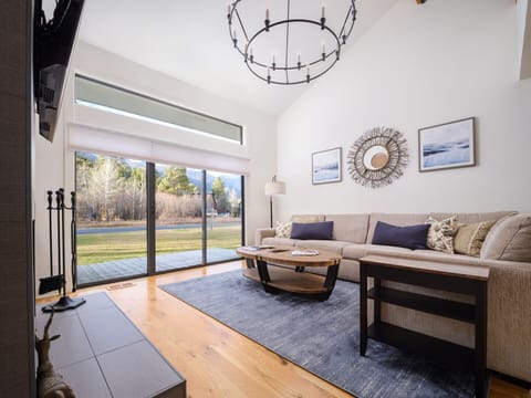 Living Room with Wood Fireplace and TV