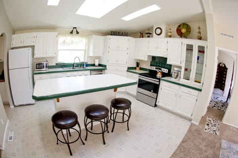Kitchen with island and skylights