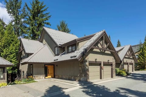 - Mountain chalet exterior surrounded by tall pines perfect for Whistler stays  
- Spacious driveway and private garage with easy resort access  
- Ideal retreat for families seeking peaceful alpine comfort  
