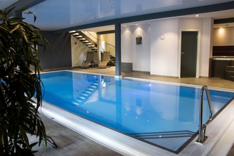 Indoor pool, open 7 AM to 7 PM, sun loungers