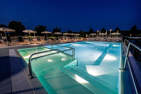 Seasonal outdoor pool, open 9:00 AM to 11:00 PM, pool umbrellas