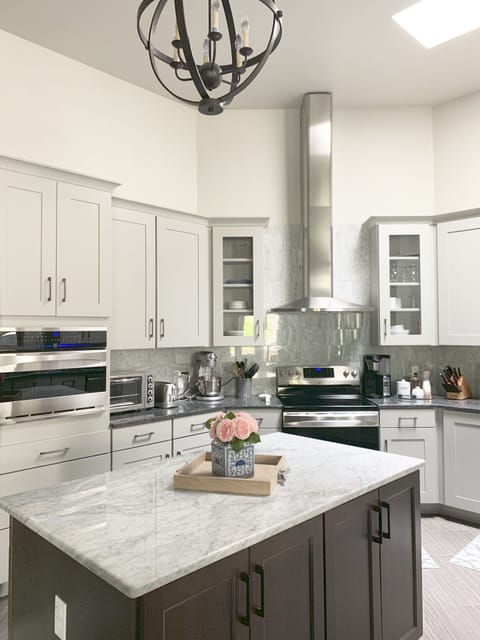 Kitchen features marble and granite counters, ss appliances & conv. oven