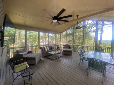 Newly Renovated Covered Porch with TV, lounge furniture, fans, & safety railings