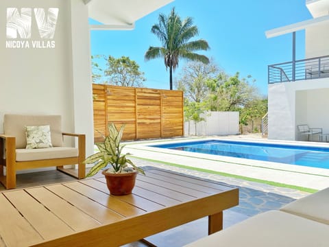 Patio area overlooking the pool for Villa 1.