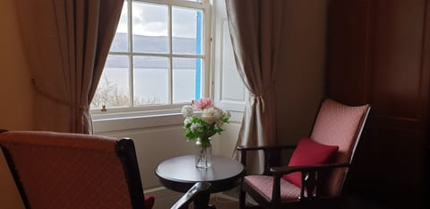 Deluxe Double Room | Living area | Flat-screen TV