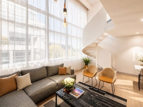 Penthouse | Living area | 32-inch TV with cable channels