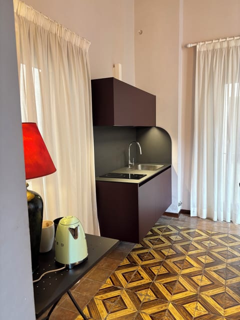 Suite, Annex Building ( Via Cavour 96 ) | Private kitchen | Fridge, coffee/tea maker