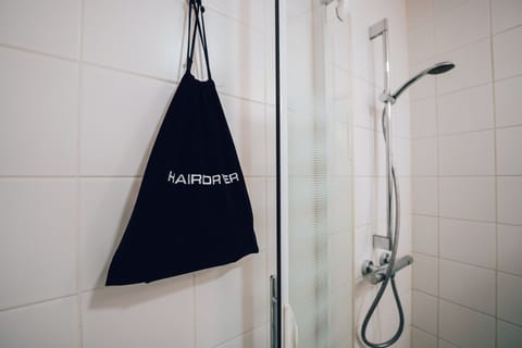 Shower, eco-friendly toiletries, hair dryer, towels