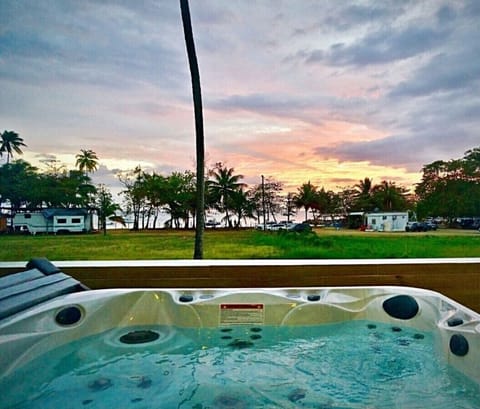 Relaxing 6 person jacuzzi spa with massaging jets facing the beach
