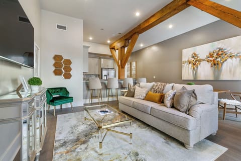 Open-concept living, kitchen, and dining area with plenty of seating. Enjoy a 65” Samsung Smart 4K TV with streaming and DIRECTV Entertainment. Dining table for four and lots of natural light!