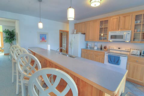 Large Bar Seating Area by Kitchen