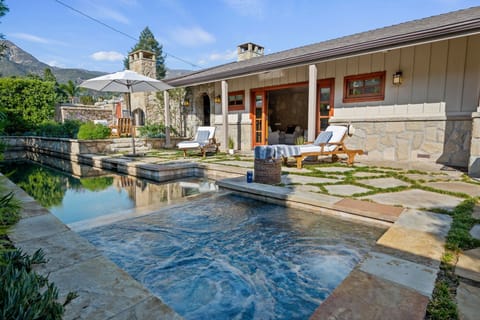 Luxurious lap pool and hot tub stun at this classic Montecito retreat