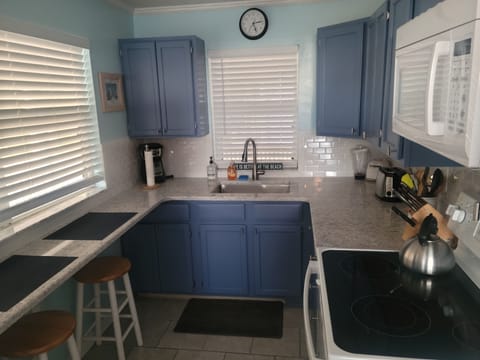New quartz countertops, new glasstop stove and fresh painted cabinets.