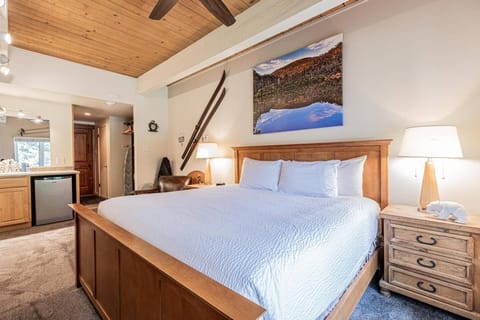 Crisp white linens and warm lighting create the perfect cozy vibe.