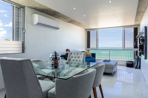 Glass top square dining room table where 6 people can eat comfortably