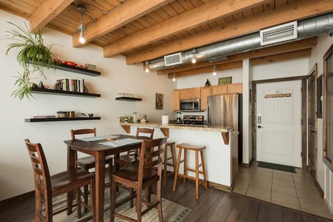 Dining table and kitchen.