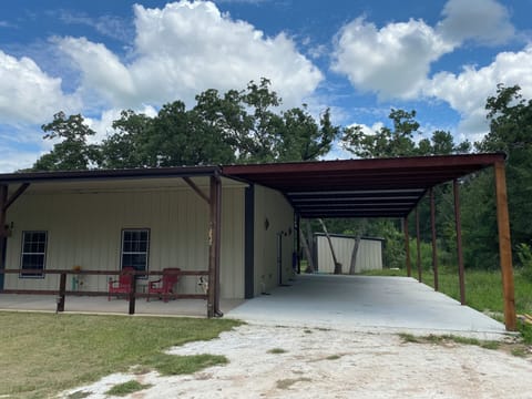 We have a newly added 1000 sq ft covered car port to park under